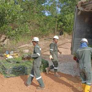 Workers laying cow grass turf at PETRONAS pipeline ban project